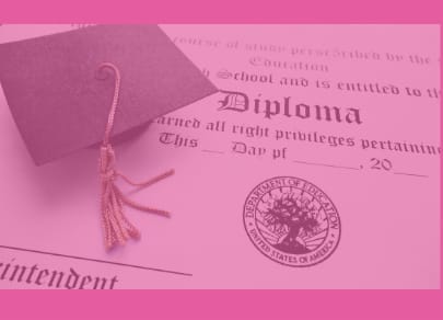 A mortarboard on top of a diploma
